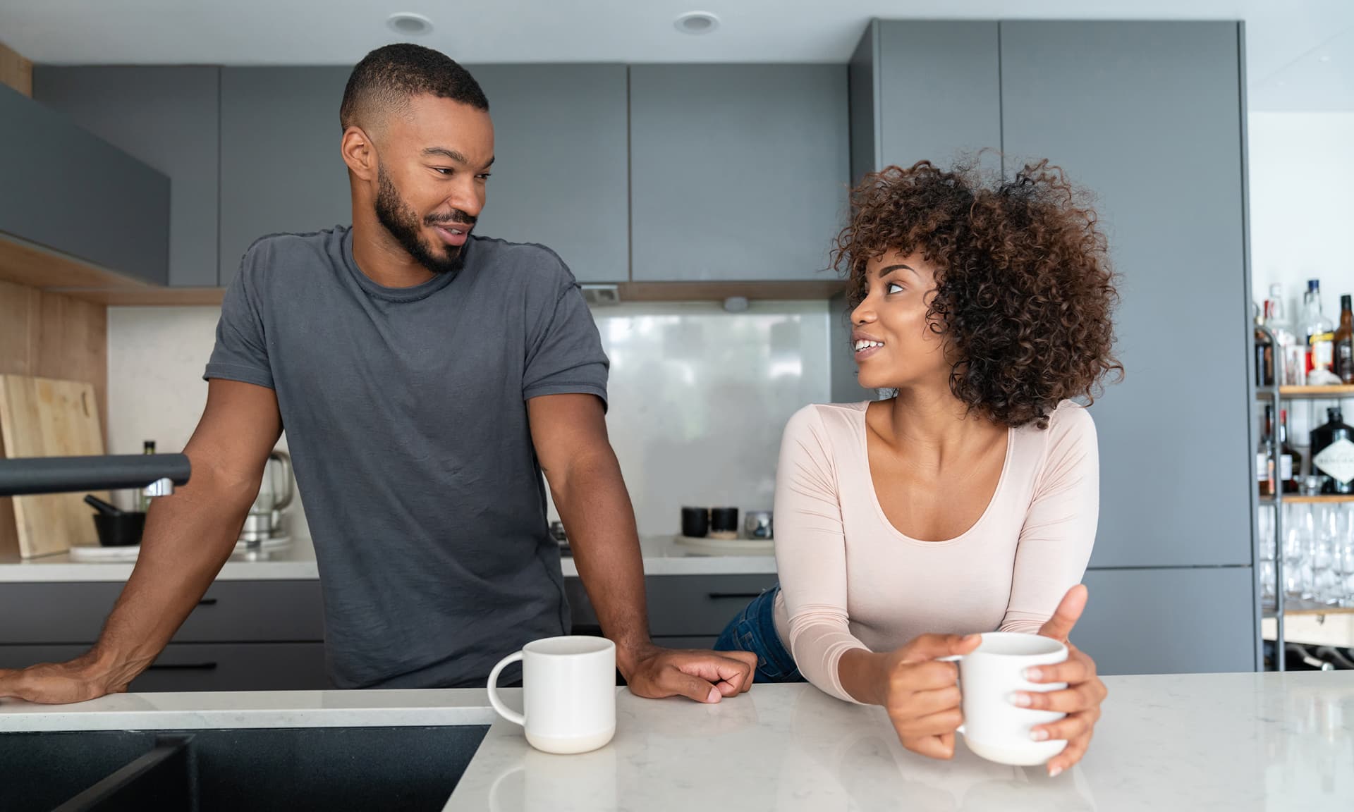 Couple talking in kitchen